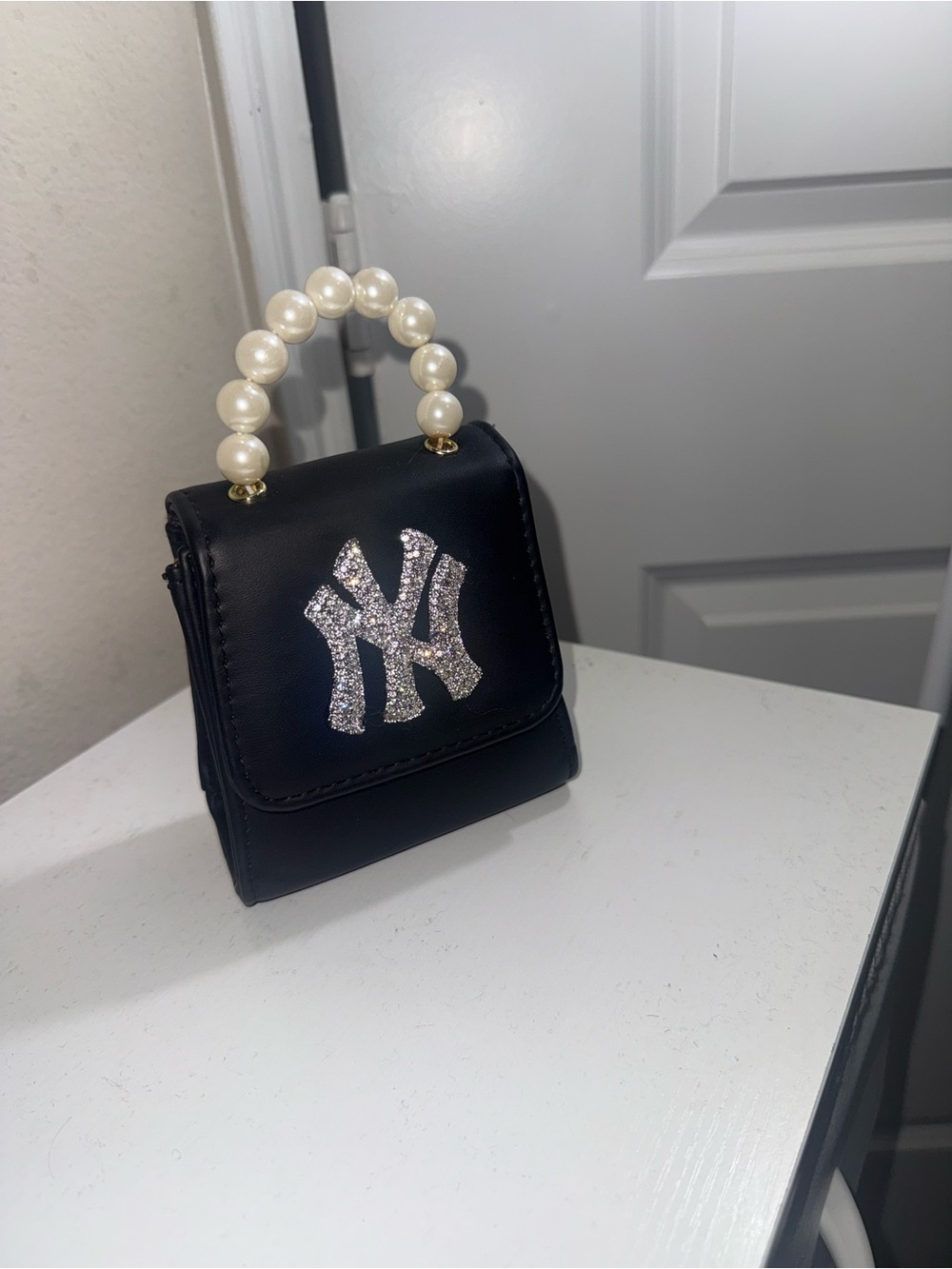 Black Mini Handbag with Pearl Handle and Crystal NY Accent